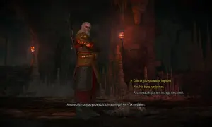 Geralt w zbroi stoi w jaskini, w cieniu wiecznego ognia. W tle widać pochodnie i stalaktyty.