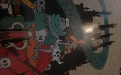 Kolorowy komiks z postaciami w stylu fantasy, przypominającymi bohaterów gry o nazwie "dożon". W tle widać zarys zamku.