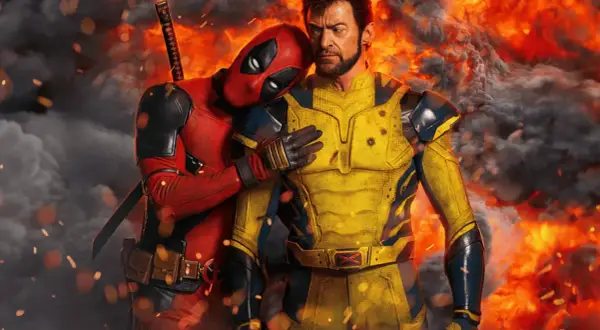 Deadpool przytula się do Wolverine'a na tle płomieni. Zapowiedź premiery Deadpool 3.