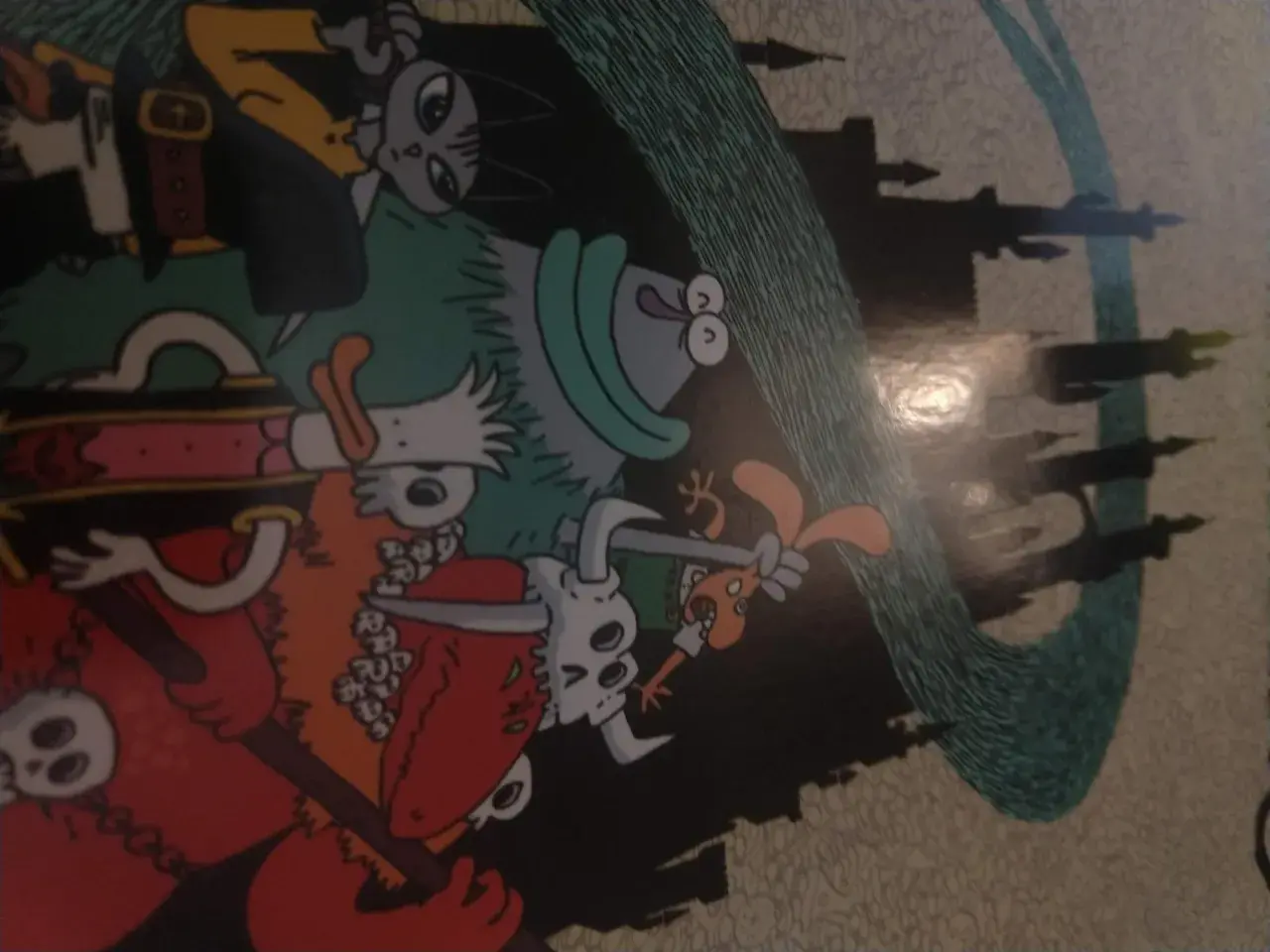 Kolorowy komiks z postaciami w stylu fantasy, przypominającymi bohaterów gry o nazwie "dożon". W tle widać zarys zamku.