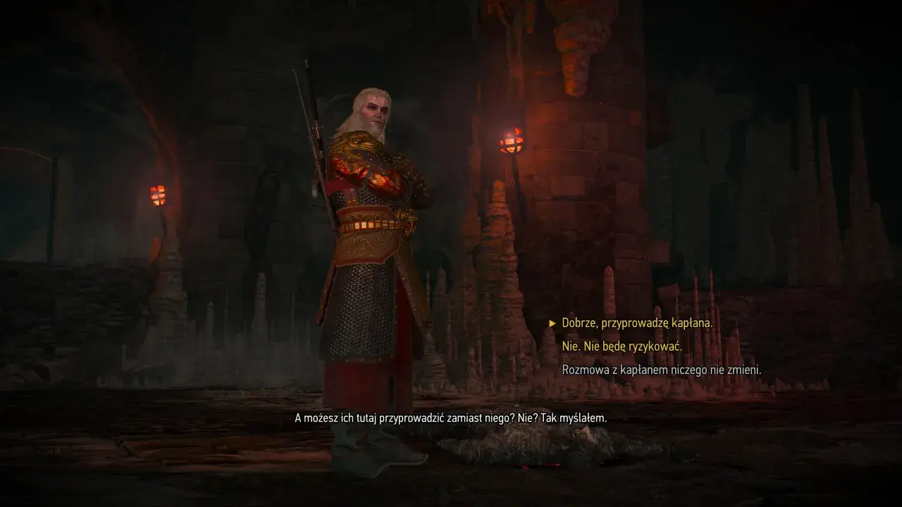 Geralt w zbroi stoi w jaskini, w cieniu wiecznego ognia. W tle widać pochodnie i stalaktyty.