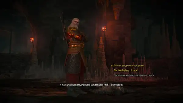 Geralt w zbroi stoi w jaskini, w cieniu wiecznego ognia. W tle widać pochodnie i stalaktyty.